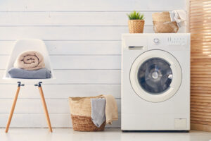 Interior of a real laundry room with a washing machine at home